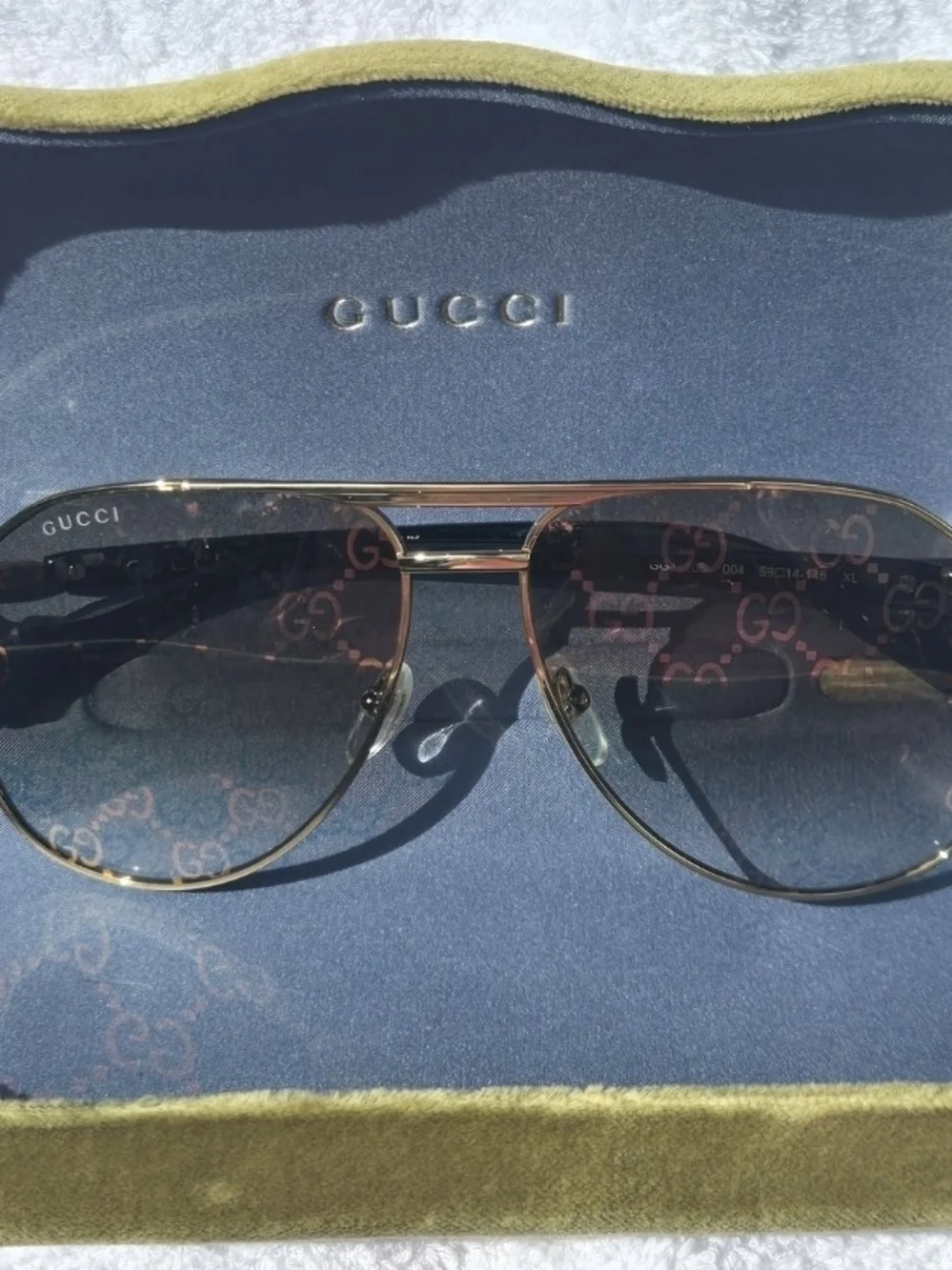 Gucci Gold Aviator Sunglasses with Black Temples and Logo-Pattern Lenses Unisex